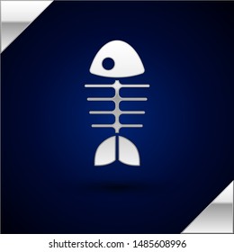 Silver Fish skeleton icon isolated on dark blue background. Fish bone sign.  Vector Illustration