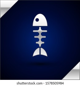 Silver Fish skeleton icon isolated on dark blue background. Fish bone sign.  Vector Illustration