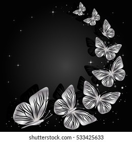 Silver flying butterflies on dark background with place for your text.