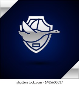 Silver Flying duck on shield icon isolated on dark blue background. Hunting trophy on wall.  Vector Illustration