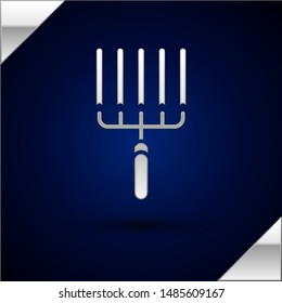 Silver Garden rake in work icon isolated on dark blue background. Tool for horticulture, agriculture, farming. Ground cultivator.  Vector Illustration