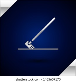 Silver Garden rake in work icon isolated on dark blue background. Tool for horticulture, agriculture, farming. Ground cultivator.  Vector Illustration