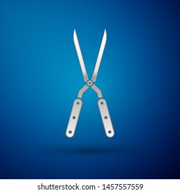 Silver Gardening handmade scissors for trimming icon isolated on blue background. Pruning shears with wooden handles.  Vector Illustration