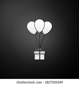 Silver Gift box with balloons icon isolated on black background. Long shadow style. Vector.