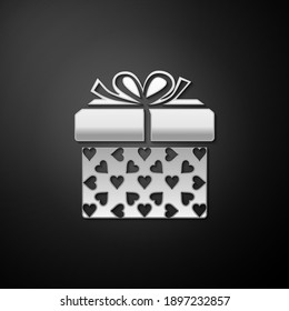 Silver Gift box and heart icon isolated on black background. Packaging Valentine's Day. Beautiful festive box tied with ribbon and bow on top. Long shadow style. Vector.