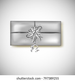 Silver gift present box with gift bow, serpentine ans confetti