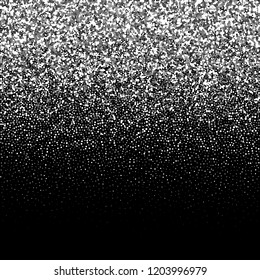 Silver glitter on a black background.