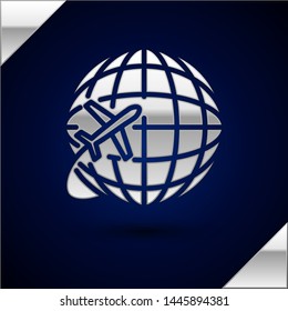 Silver Globe with flying plane icon isolated on dark blue background. Airplane fly around the planet earth. Aircraft world icon.  Vector Illustration