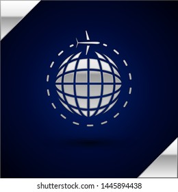 Silver Globe with flying plane icon isolated on dark blue background. Airplane fly around the planet earth. Aircraft world icon.  Vector Illustration