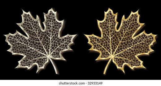 Silver and golden hand-made maple leaves isolated on black background