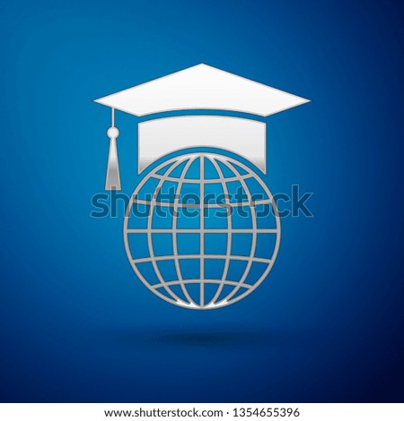 Silver Graduation cap on globe icon isolated on blue background. World education symbol. Online learning or e-learning concept. Vector Illustration