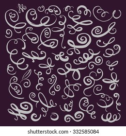 Silver hand drawn vintage swirls on dark background. Design elements for text, wedding cards and invitations. Vector illustration 