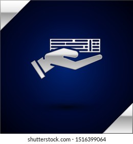 Silver Hand holding deck of playing cards icon isolated on dark blue background. Casino gambling.  Vector Illustration