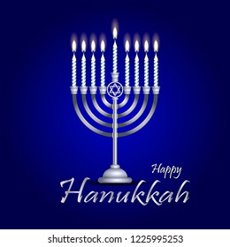 silver hanukkah menorah (hanukkiah) with nine burning candles on a blue background