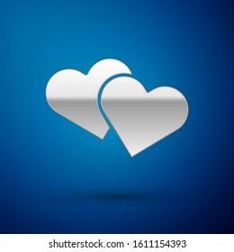 Silver Heart icon isolated on blue background. Romantic symbol linked, join, passion and wedding. Valentine day symbol.  Vector Illustration