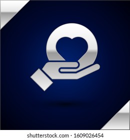 Silver Heart on hand icon isolated on dark blue background. Hand giving love symbol.  Vector Illustration