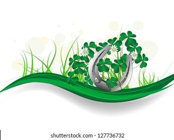 Silver horseshoe with clover leaves and ribbons