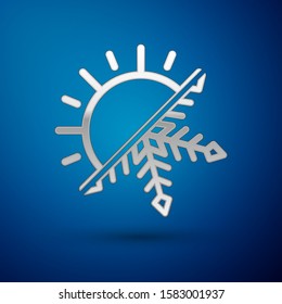 Silver Hot and cold symbol. Sun and snowflake icon isolated on blue background. Winter and summer symbol.  Vector Illustration