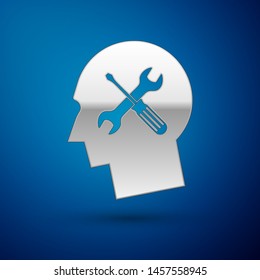 Silver Human head with with screwdriver and wrench icon isolated on blue background. Artificial intelligence. Symbol work of brain.  Vector Illustration