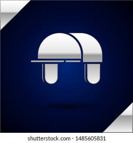 Silver Hunter hat icon isolated on dark blue background. Plaid winter hat.  Vector Illustration