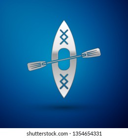 Silver Kayak and paddle icon isolated on blue background. Kayak and canoe for fishing and tourism. Outdoor activities. Vector Illustration