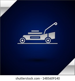 Silver Lawn mower icon isolated on dark blue background. Lawn mower cutting grass.  Vector Illustration