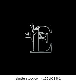 Silver Letter E Floral Nature Bamboo Leaves  logo icon. Design concept logo letter E with bamboo leaves for fashion, restaurant, cafe, hotel and more company identity.