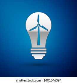 Silver Light bulb with wind turbine as idea of eco friendly source of energy icon isolated on blue background. Alternative energy concept. Vector Illustration