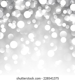 El fondo de navidad se ilumina con plata. Tarjeta de felicitación. Ilustración vectorial.