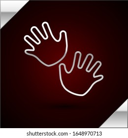 Silver line Baby hands print icon isolated on dark red background.  Vector Illustration