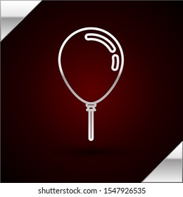 Silver line Balloon with ribbon icon isolated on dark red background.  Vector Illustration