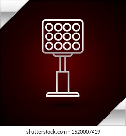 Silver line Bright stadium lights icon isolated on dark red background. Spotlight on a football field. Floodlight, light projector.  Vector Illustration