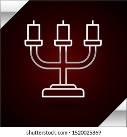Silver line Candlestick icon isolated on dark red background.  Vector Illustration