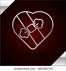 Silver line Candy in heart shaped box and bow icon isolated on dark red background. Valentines Day.  Vector Illustration