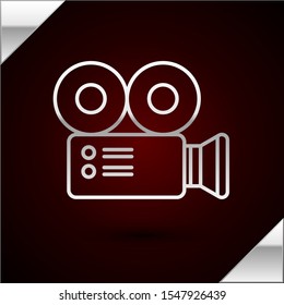 Silver line Cinema camera icon isolated on dark red background. Video camera. Movie sign. Film projector.  Vector Illustration