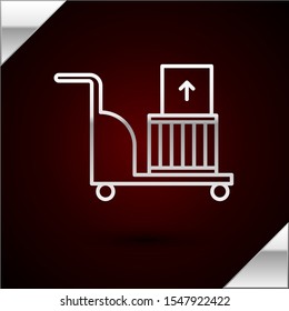 Silver line Electric hand truck and boxes icon isolated on dark red background. Dolly symbol.  Vector Illustration