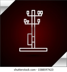 Silver line Electric tower used to support an overhead power line icon isolated on dark red background. High voltage power pole line.  Vector Illustration