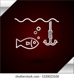 Silver line Fishing hook under water with fish icon isolated on dark red background. Fishing tackle.  Vector Illustration