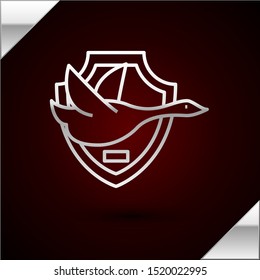 Silver line Flying duck on shield icon isolated on dark red background. Hunting trophy on wall.  Vector Illustration