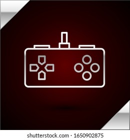 Icono de Gamepad de línea plateada aislado en fondo rojo oscuro. Controlador de juego.  Ilustración vectorial