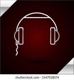 Silver line Headphones icon isolated on dark red background. Earphones sign. Concept for listening to music, service, communication and operator.  Vector Illustration