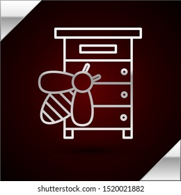 Silver line Hive for bees icon isolated on dark red background. Beehive symbol. Apiary and beekeeping. Sweet natural food.  Vector Illustration