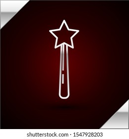 Silver line Magic wand icon isolated on dark red background. Star shape magic accessory. Magical power.  Vector Illustration
