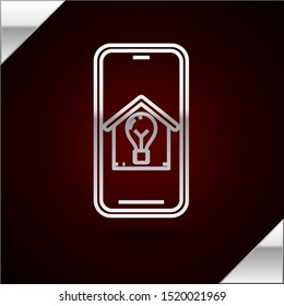 Silver line Mobile phone with smart house and light bulb icon isolated on dark red background.  Vector Illustration