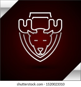 Silver line Moose head on shield icon isolated on dark red background. Hunting trophy on wall.  Vector Illustration