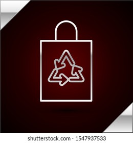 Silver line Plastic bag with recycle icon isolated on dark red background. Bag with recycling symbol.  Vector Illustration