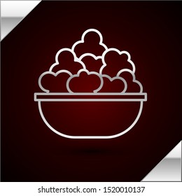 Silver line Popcorn in bowl icon isolated on dark red background. Popcorn bucket box.  Vector Illustration