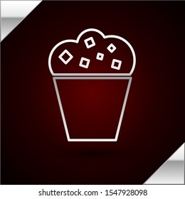 Silver line Popcorn in cardboard box icon isolated on dark red background. Popcorn bucket box.  Vector Illustration
