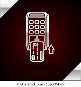 Silver line Pos terminal with inserted credit card icon isolated on dark red background. Payment terminal transaction. Pay by card.  Vector Illustration