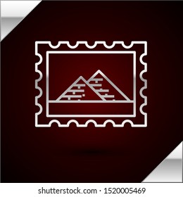 Silver line Postal stamp and Egypt pyramids icon isolated on dark red background.  Vector Illustration